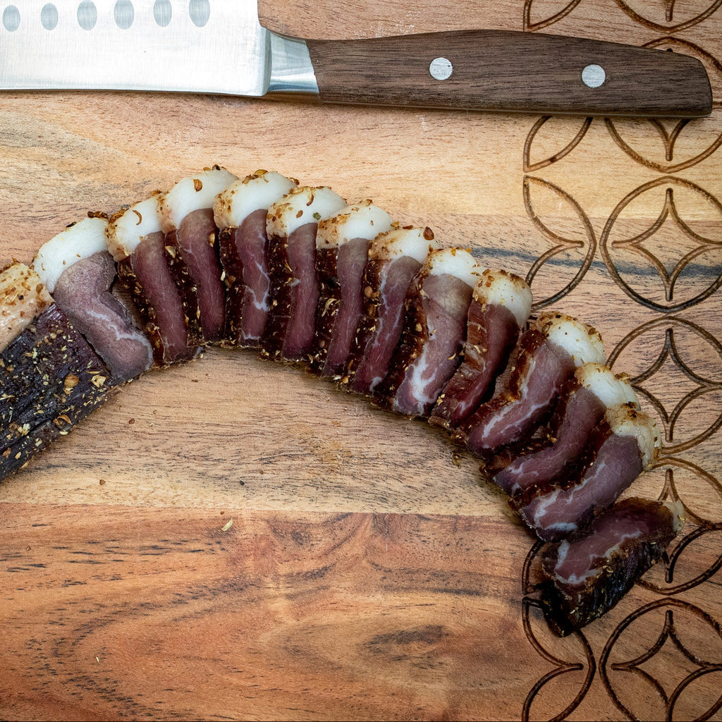 Proper Sliced Wet Biltong with a fat layer, showing the difference between biltong and jerky